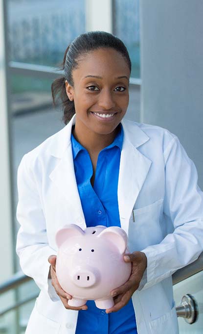 dentist holding a piggy bank and offering benefits of the dental savings plan