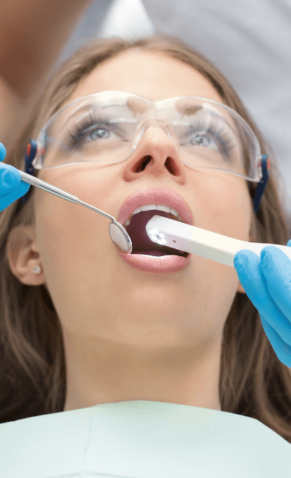 Dentist using intraoral camera to capture images