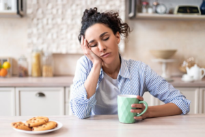 Woman slumped over at breakfast because she got no sleep